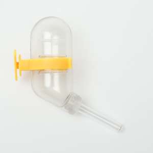 Поилка для грызунов 60мл 12*4см прозрачная с желтым креплением Пижон